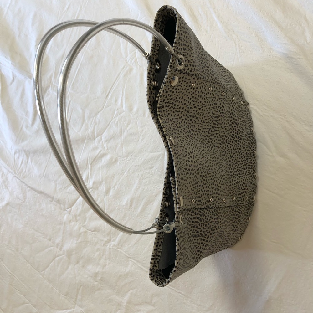 Uniquely designed bag. Poly bag with wooden bottom